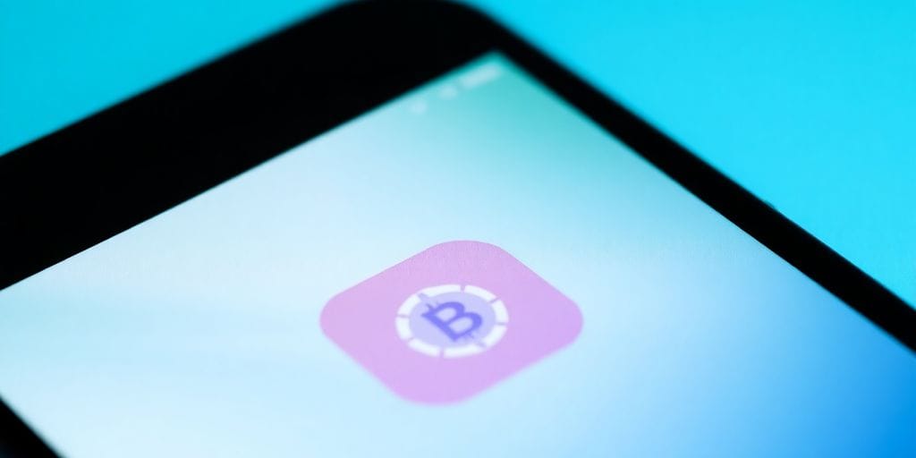 Android phone with crypto app icon.