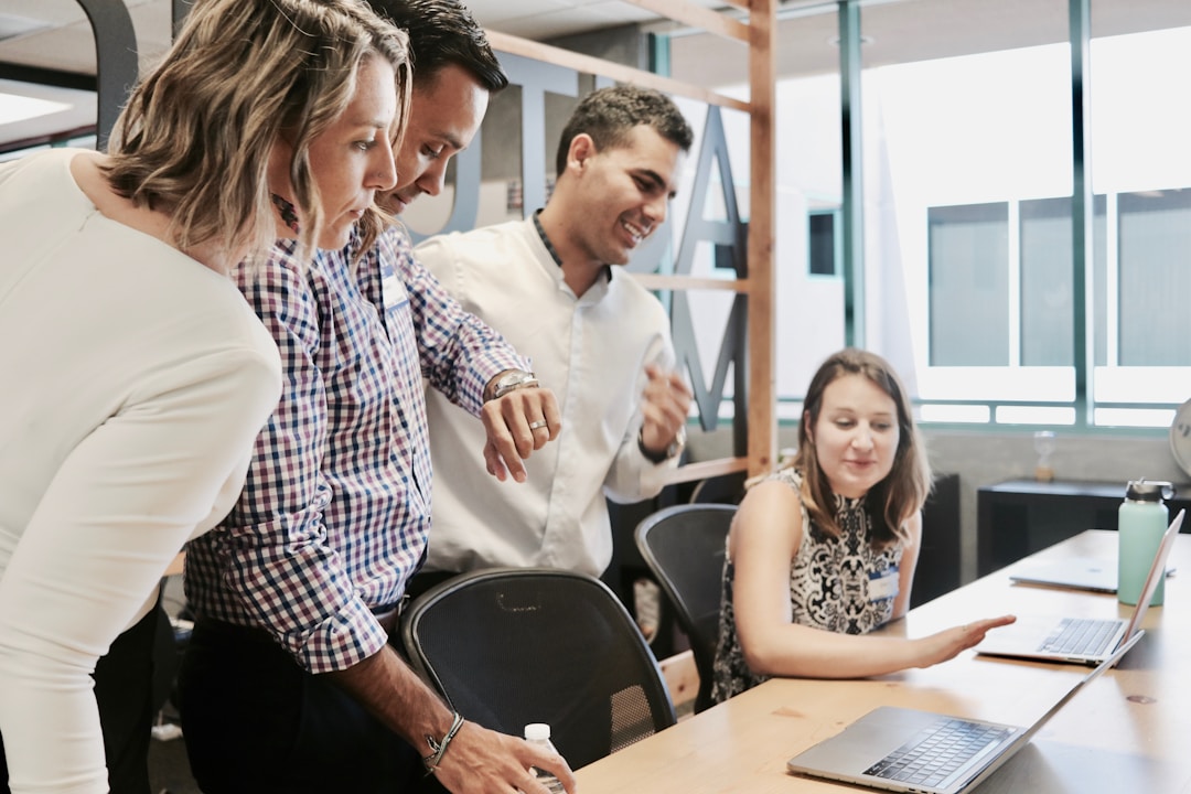 Employees in an office setting are enhancing data accessibility and information retrieval with enterprise search