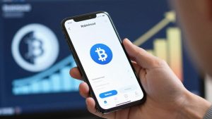 Robinhood app on phone with crypto symbol