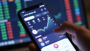Smartphone trading interface with dynamic financial data.